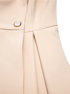 Abrigo estilo años 50 color crema con cuello de solapa